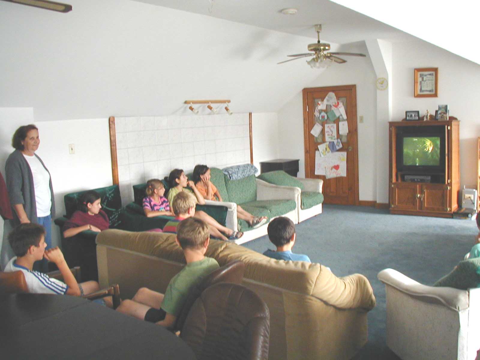The children relax watching a video in the television room at Dornesti.